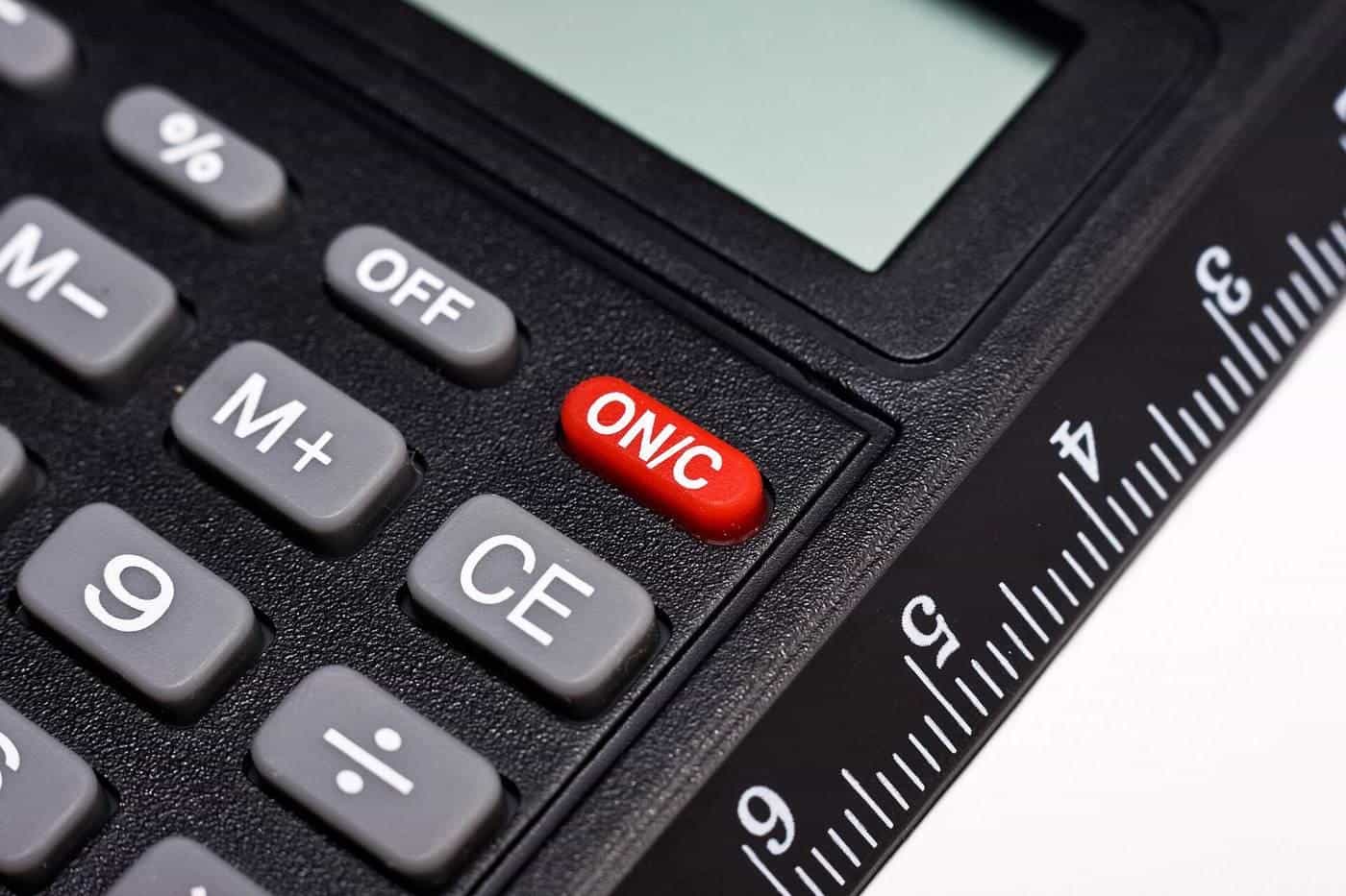 Close-up of calculator buttons and a ruler