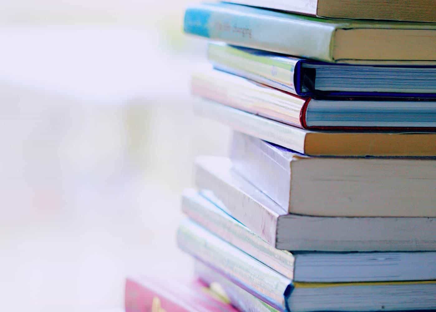A stack of colourful books on a table