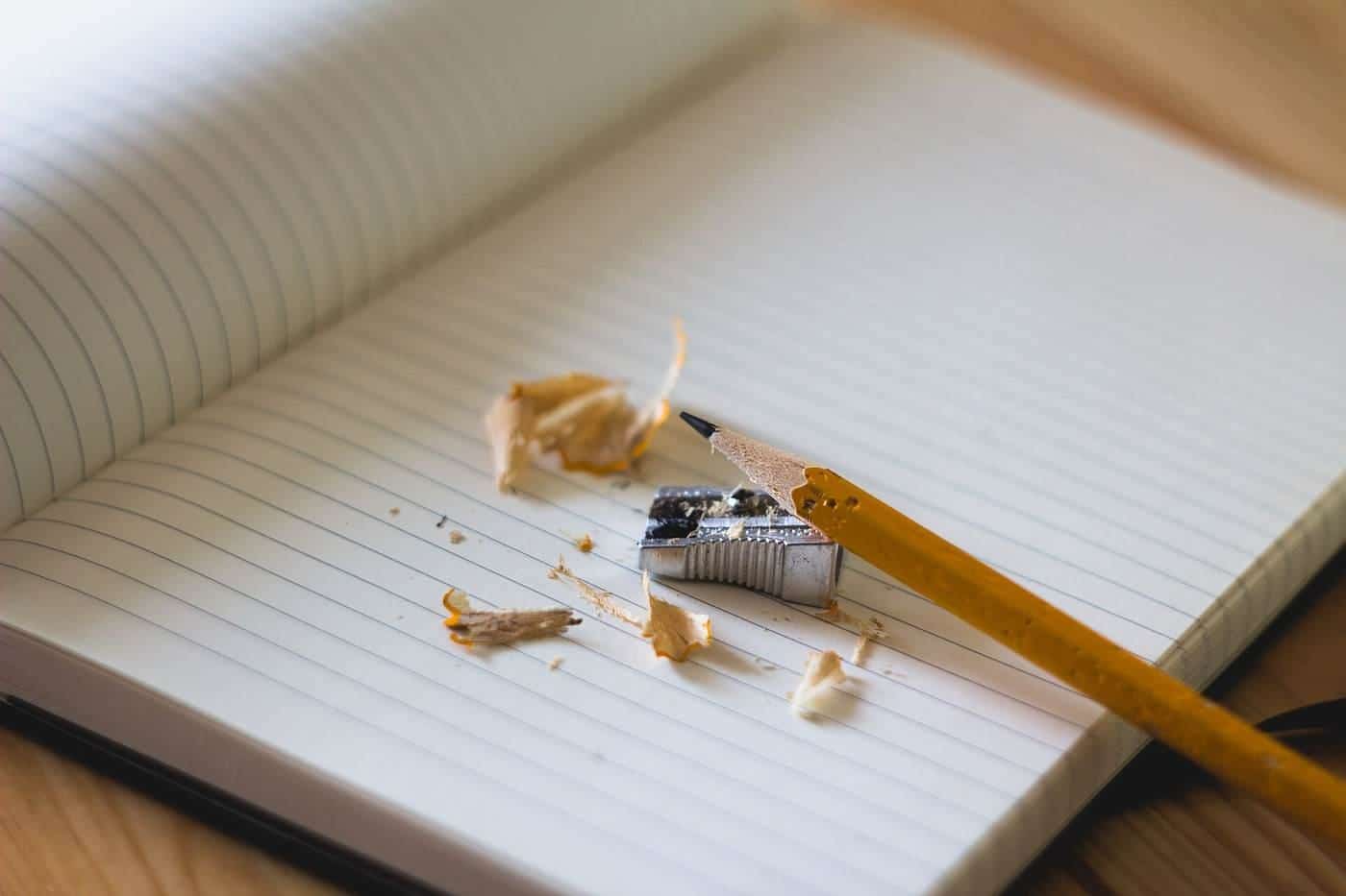 Pencil shavings on an open notebook